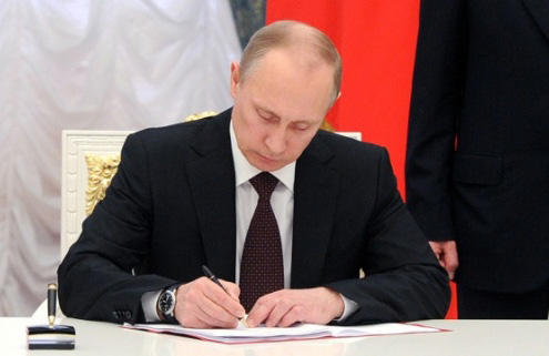 Putin signs law toughening conviction for terrorist recruiters