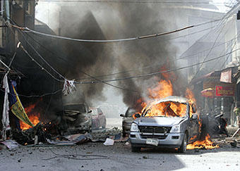 Eighteen hurt as two car blasts target Libya military unit