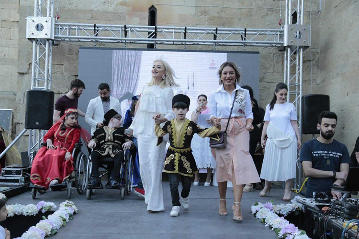 Children with special needs walk on podium [PHOTO]