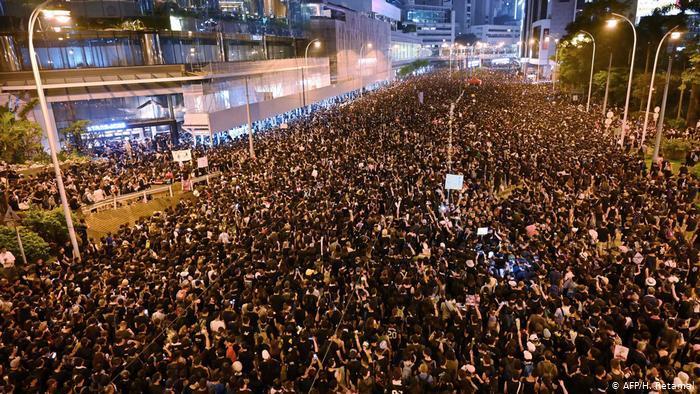 Hong Kong teachers rally in thunderstorm at start of weekend of protests