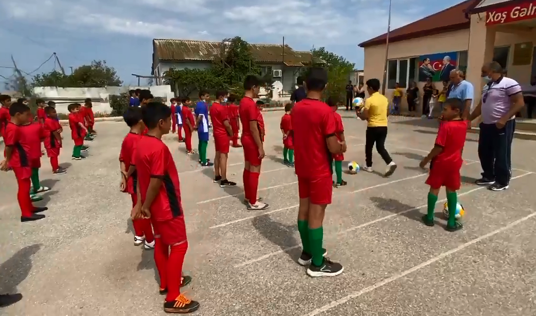 Azerbaijani MPs present football uniforms to IDP school children [VIDEO]