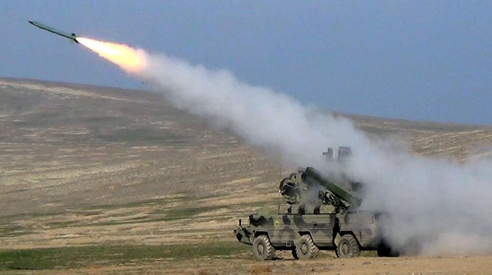 Armenian armed forces shelling Azerbaijani Aghdam region