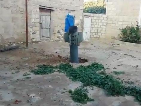 'Smerch' missile launched by Armenia lands in private house garden in Azerbaijan (VIDEO)