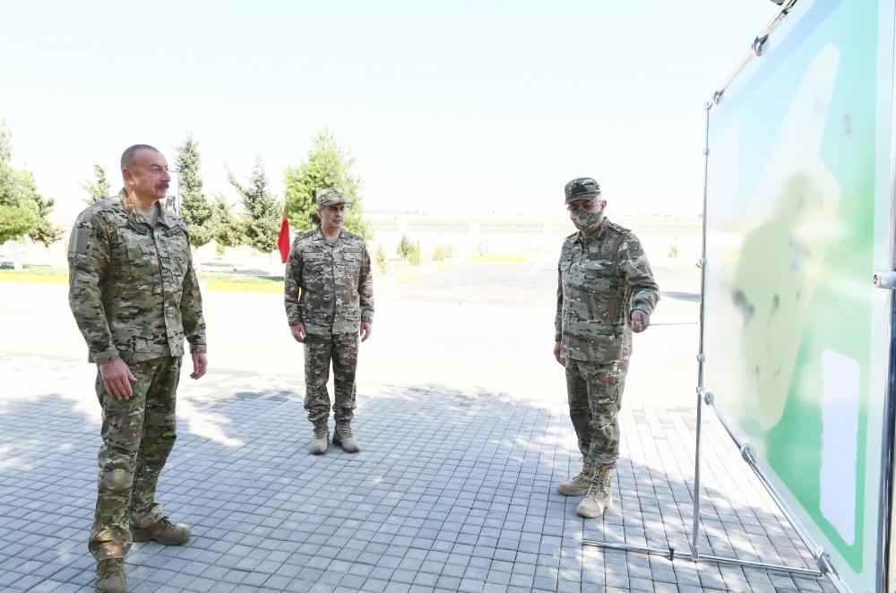 Azerbaijani president familiarizes with new military camp, apartments for servicemen families of Air Force [PHOTO]