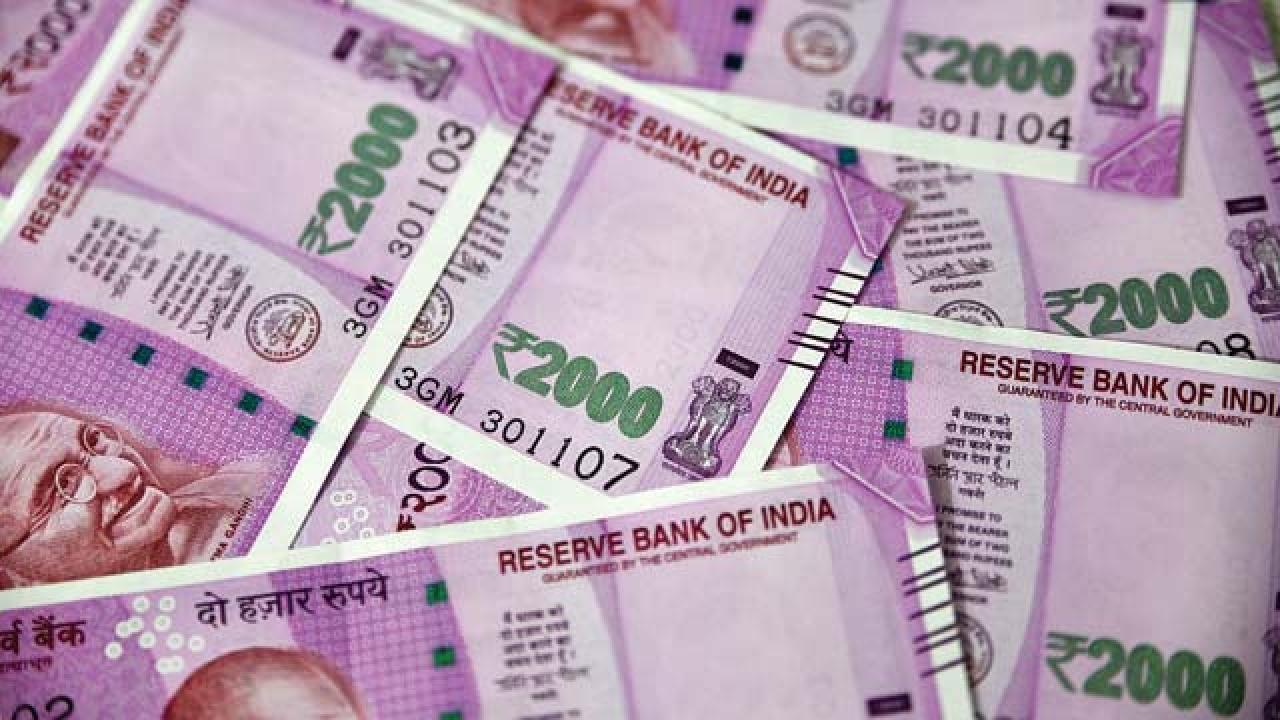 India's rupee slips below 75 against dollar; closes at six-week low