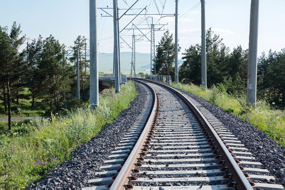 Freight wagons of Georgian railway train carrying raw sugar to Azerbaijan rolled over