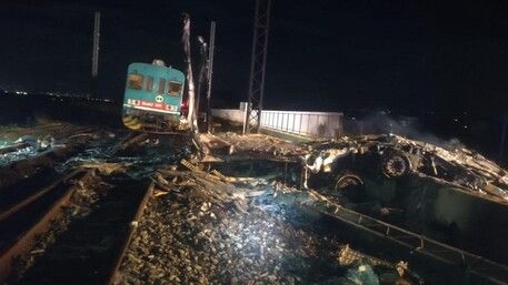 Two dead after train collides with truck in Italy