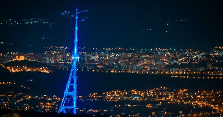 Tbilisi TV Tower, Bridge of Peace illuminated in EU flag colours following receiving bloc’s candidate status