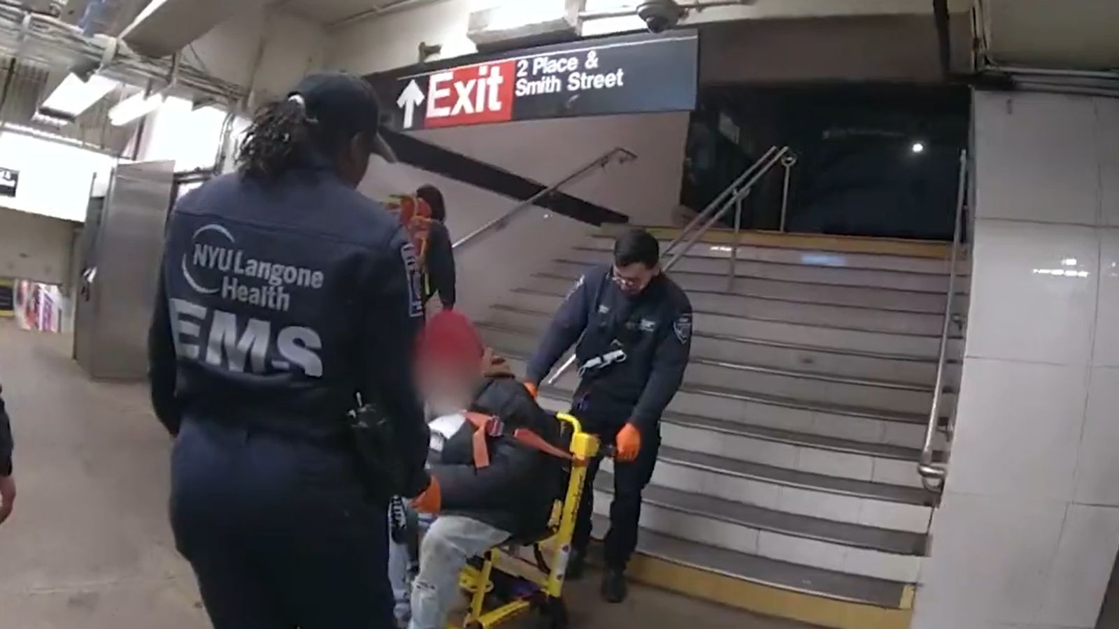 Police officer jumps onto subway tracks to rescue man