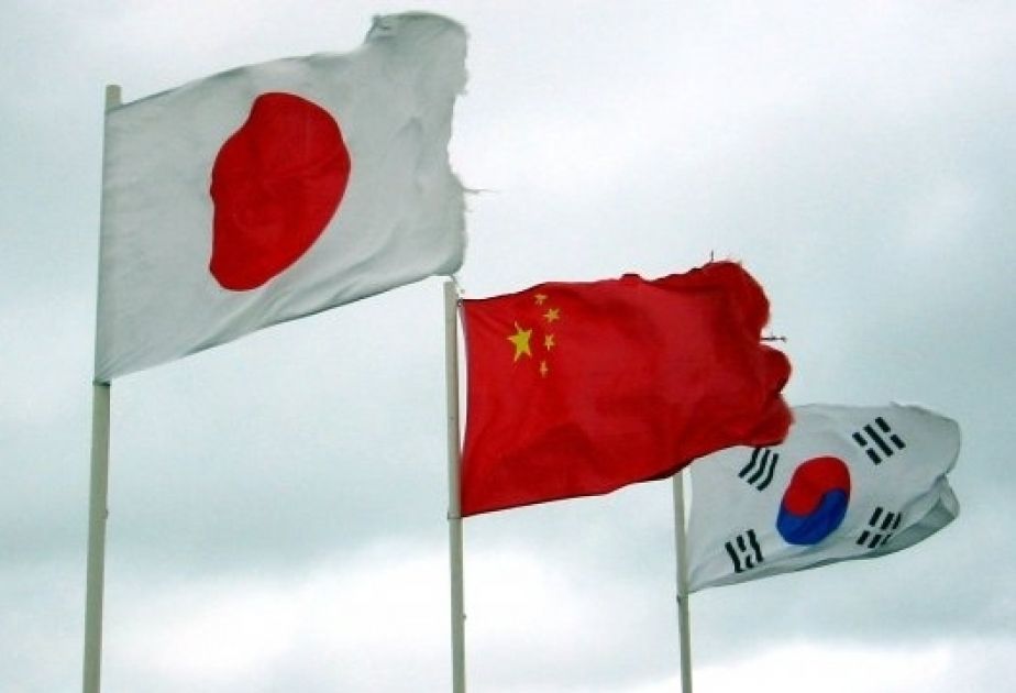 China, Japan and South Korea looking to hold summit in May, reports say