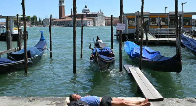 Europe bakes in summer's first heatwave as continent warms