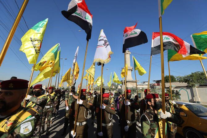 Iraqi prime minister removes paramilitary commanders after deadly clash with police