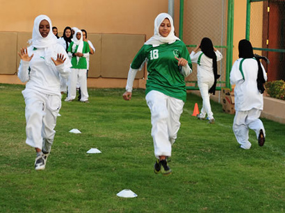 Iranian woman athlete holds hijab, becomes champion
