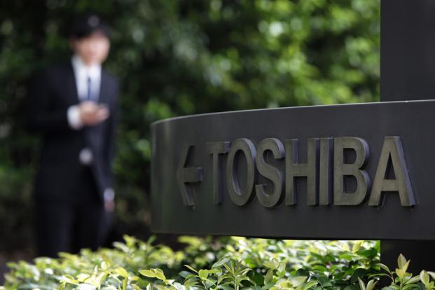 Toshiba drops as profit charge said to double on accounting